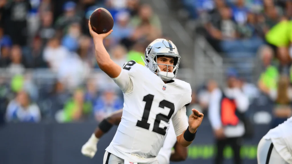 Las Vegas Raiders quarterback Aidan O'Connell (12) passes the ball against the Seattle Seahawks during the first half at Lumen Field.