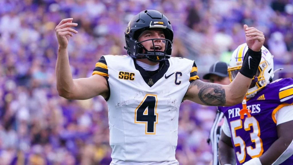 Sep 14, 2024; Greenville, North Carolina, USA; Appalachian State Mountaineers quarterback Joey Aguilar (4) reacts after the touchdown against the East Carolina Pirates during the first half at Dowdy-Ficklen Stadium. Mandatory Credit: James Guillory-Imagn Images | James Guillory-Imagn Images.