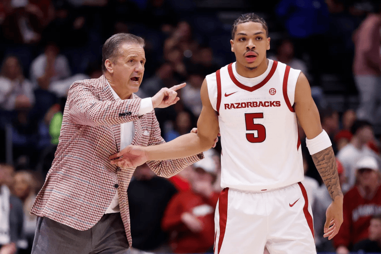 Head coach John Calipari and Darius Acuff Jr. #5 of the Arkansas Razorbacks talk during the first half against the Oklahoma Sooners in the quarterfinal game of the 2026 SEC Men's Basketball Tournament at Bridgestone Arena.