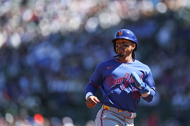 Francisco Lindor #12 of the New York Mets runs to third base during the first inning against the Chicago Cubs at Wrigley Field.